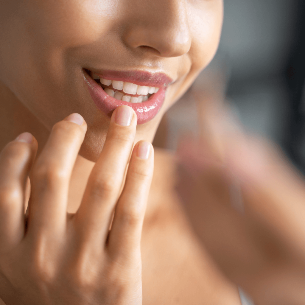 woman applying lip balm 