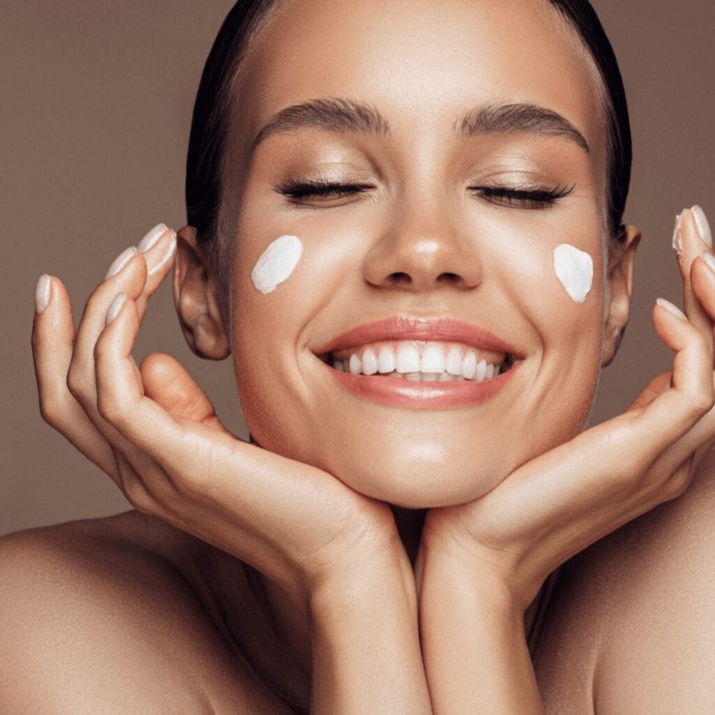 woman smiling with SPF on her face