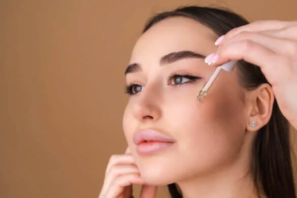 woman putting acids on her face