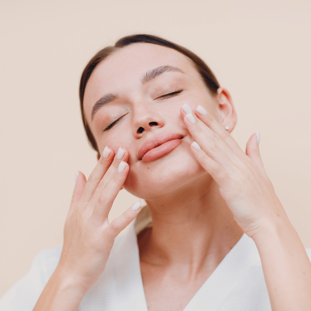 woman applying a skincare product