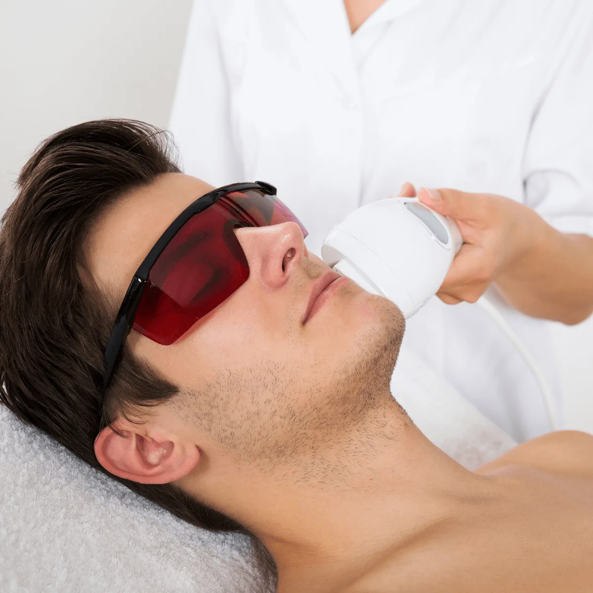 man getting a laser hair removal