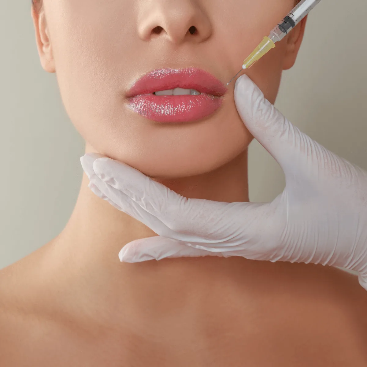 woman getting lip fillers injected 