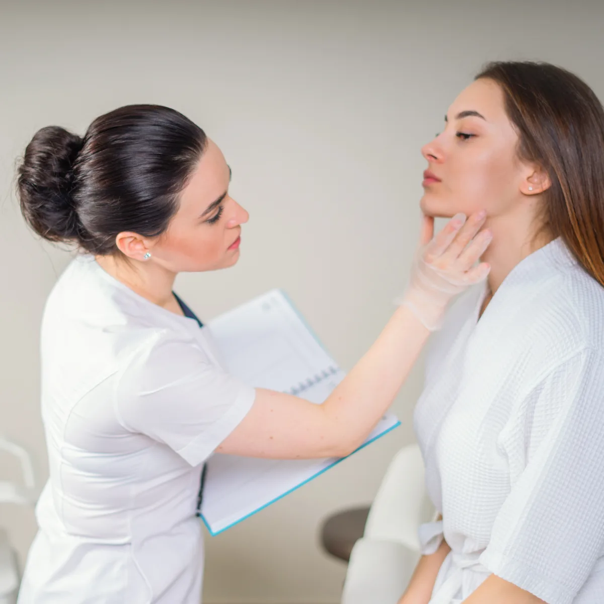 a dermatologist consulting her patient 