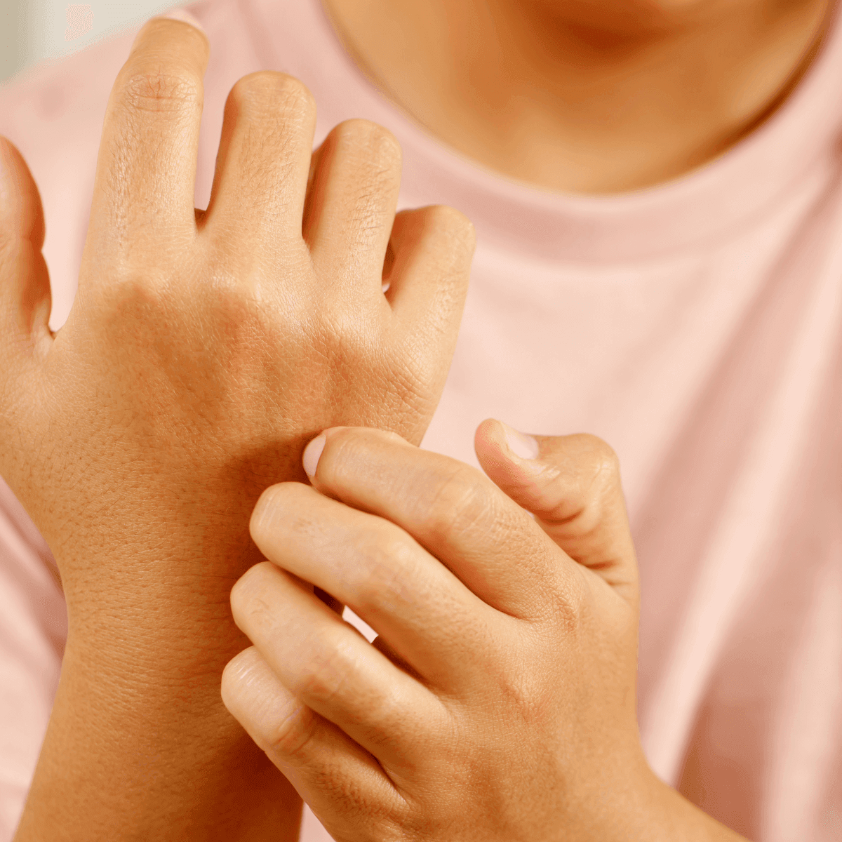 woman experiencing itchiness and skin irritation