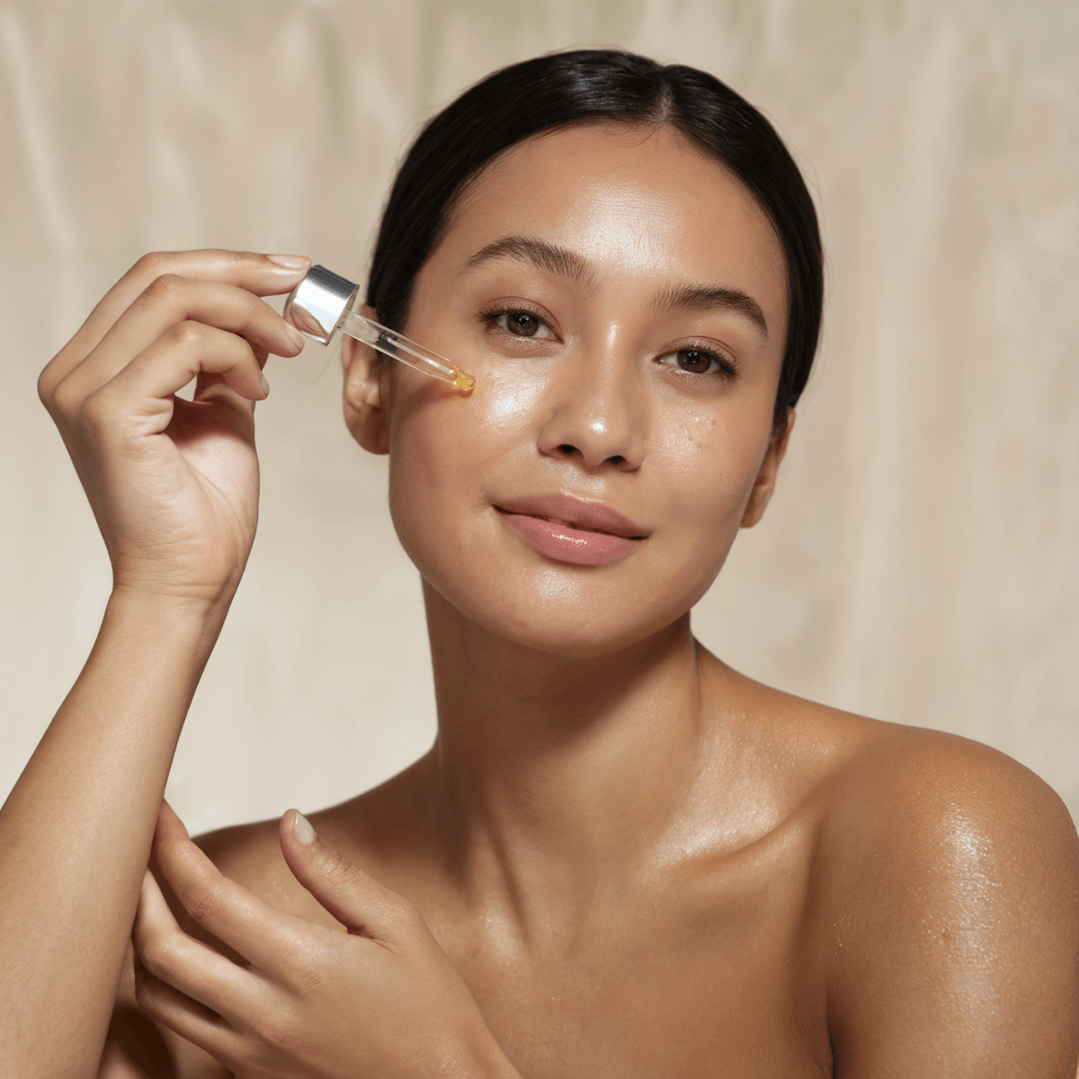 woman applying a serum with active ingredients